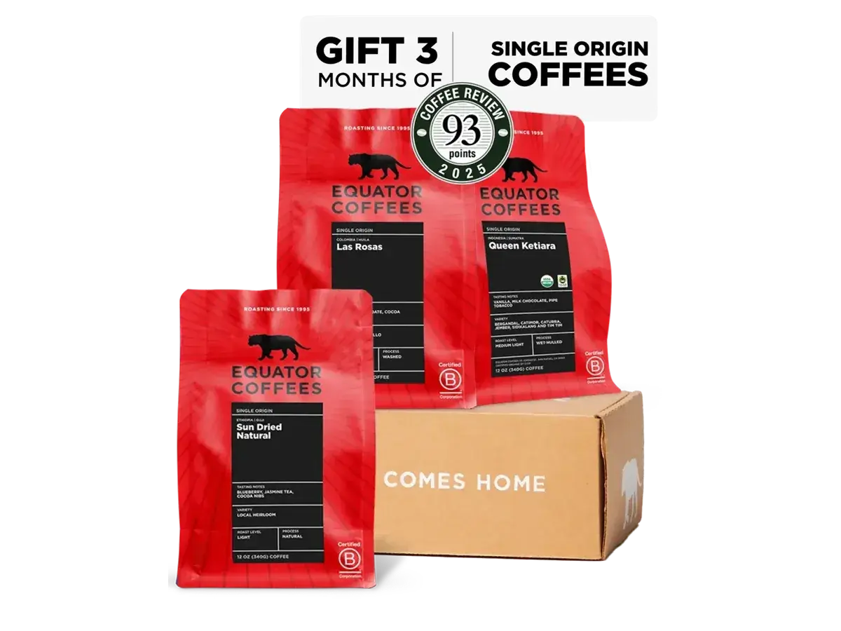 Three red Equator Coffees single origin bags with a gift box