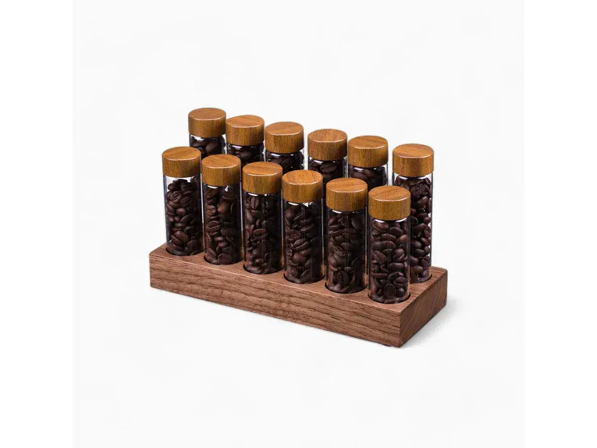 Glass coffee bean tubes with cork stoppers in a walnut wood stand